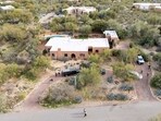 Nancy Guthrie kidnapping: A drone view shows investigators searching the home of Nancy Guthrie, the 84-year-old mother of US journalist and television host Savannah Guthrie, who went missing from her home in Tucson, Arizona, U.S., February 6, 2026.  REUTERS/Rebecca Noble