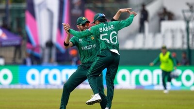 Babar Azam and Shaheen Shah Afridi celebrate after taking a co-ordinated catch to dismiss Netherlands' Michael Levitt. (AP) Babar Azam and Shaheen Shah Afridi celebrate after taking a co-ordinated catch to dismiss Netherlands' Michael Levitt. (AP)