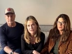 Savannah Guthrie, accompanied by her siblings Annie and Camron, speaks in a video message. 