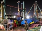 Police personnel at the spot after a swing fell down at Surajkund fair, in Faridabad, Saturday, Feb. 7, 2026. A police officer was killed and 13 other suffered injuries.