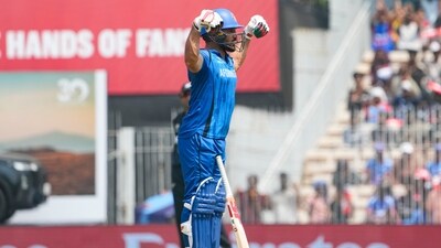 Gulbadin Naib celebrated his half-century in style by flexing his muscles. (PTI) Gulbadin Naib celebrated his half-century in style by flexing his muscles. (PTI)