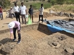 A researcher inspects an excavation trench in Tekkalakote on Sunday. (HT PHOTO)