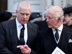 FILE PHOTO: Britain's Prince Andrew speaks with King Charles as they leave Westminster Cathedral