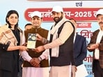 Haryana chief minister Nayab Singh Saini honouring hockey player Savita Punia. (Sourced)