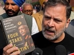 Leader of Opposition in the Lok Sabha Rahul Gandhi speaks to the media as he shows a copy of the unpublished memoir of former Indian Army chief Gen MM Naravane outside Parliament in New Delhi.