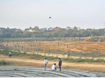 As of February 4, Welcome jheel lies barren, filled with weeds, burnt grass, and rubble, acting as a playground for kids. 