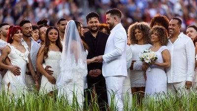 A couple got married on the stage during the Bad Bunny halftime show in Super Bowl LX between the Seattle Seahawks and the New England Patriots at Levi's Stadium. Mandatory Credit: Mark J. Rebilas-Imagn Images (IMAGN IMAGES via Reuters Connect)