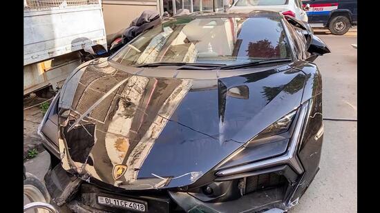 A view of a damaged Lamborghini car seized by the Gwaltoli police station. (ANI Video Grab)