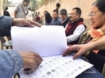 Guwahati: Voters check their names in the voter list during the Special Revision ahead of Assam assembly elections (PTI)