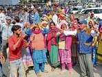 Nagar Nigam Karamchari Union members protest on Ferozepur road in Ludhiana on Monday. (Gurpreet Singh/HT)