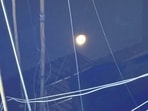 The cables remain adrift, trapping the unsuspecting moon in their tangle. (Mayank Austen Soofi) The cables remain adrift, trapping the unsuspecting moon in their tangle. (Mayank Austen Soofi)