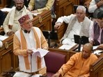 UP finance minister Suresh Khanna and chief minister Yogi Adityanath on the first day of the budget session of the state assembly. (Deepak Gupta/HT)
