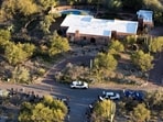 A drone view shows media staging near the home of Nancy Guthrie, the 84-year-old mother of U.S. journalist and television host Savannah Guthrie, who went missing from her home in Tucson.