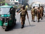 Members of the Bangladesh Army check vehicles at a checkpoint, a day ahead of the national election in Dhaka.