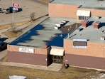 Aerial view of the Tumbler Ridge secondary school building where a shooting took place, leaving at least nine people dead in the small town of Tumbler Ridge, British Columbia, on February 11, 2026. 