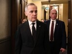 Canada's Prime Minister Mark Carney enters the House of Commons to deliver a statement on the mass shooting in Tumbler Ridge on Parliament Hill on February 11, 2026 in Ottawa, Ontario.