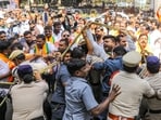 Police restrain BJP workers during a protest over the incident at the Telangana DGP’s office in Hyderabad on Tuesday. (PTI)