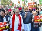 Punjab Congress president Amrinder Singh Raja Warring with party leaders Bhupesh Baghel, Dharamvir Gandhi and others during a protest march against the alleged deterioration of law and order in the state, in Patiala on Wednesday. (PTI)