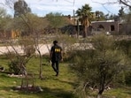 An investigator canvasses Annie Guthrie's neighborhood after the disappearance of Nancy Guthrie.