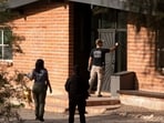 Investigators canvass Annie Guthrie's neighborhood after the disappearance of Nancy Guthrie, the 84-year-old mother of U.S. journalist and television host Savannah Guthrie, who went missing from her home in Tucson, U.S. February 10, 2026.  REUTERS/Rebecca Noble
