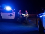 Santa Cruz County Sheriff's deputies block a street where a person was detained for questioning after the disappearance of Nancy Guthrie, the 84-year-old mother of U.S. journalist and television host Savannah Guthrie, who went missing from her home, in Rio Rico, Arizona, U.S. February 10, 2026.  REUTERS/Rebecca Noble