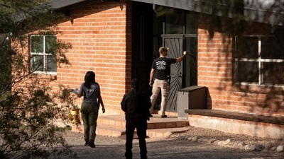 Investigators canvass Annie Guthrie's neighborhood after the disappearance of Nancy Guthrie, the 84-year-old mother of U.S. journalist and television host Savannah Guthrie, who went missing from her home in Tucson, U.S. February 10, 2026.  REUTERS/Rebecca Noble (REUTERS)