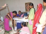 Chhattisgarh - 15 June 2010 - Villagers queue up to collect their quota of food grains from ration shop in Bastar village. HT Photo by Ejaz Kaiser (Hindustan Times)