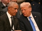 Former US President Barack Obama speaks with President-elect Donald Trump before the State Funeral Service for former US President Jimmy Carter at the Washington National Cathedral in Washington, DC, on January 9, 2025.