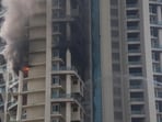 Mumbai, India - October 22, 2021: Firefighters try to douse a fire in the 60-storey highrise tower One Avighna Park, at Currey Road, in Mumbai, India, on Friday, October 22, 2021. (Photo by Pratik Chorge/Hindustan Times) (Pratik Chorge/HT PHOTO)
