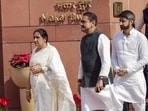 New Delhi: Maharashtra Deputy Chief Minister and NCP MP Sunetra Pawar, left, with her son Parth Pawar, right, and party MP Praful Patel during the Budget session of Parliament, in New Delhi, Wednesday, Feb. 11, 2026. (PTI Photo/Ravi Choudhary)(PTI02_11_2026_000206A) (PTI)