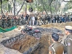 Police retrieve a motorcycle from a large ditch dug by the Delhi Jal Board at Professor Joginder Singh Marg in Janakpuri, where a biker died after falling into the pit. Police retrieve a motorcycle from a large ditch dug by the Delhi Jal Board at Professor Joginder Singh Marg in Janakpuri, where a biker died after falling into the pit.