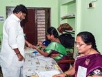Telangana Deputy CM Bhatti Vikramarka Mallu gets an ink mark on his finger as he cast his vote for the municipal corporation elections at the Indira Dairy polling station within Madhira Municipality, in Khammam on Wednesday. (@Bhatti_Mallu X)