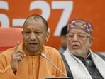 Uttar Pradesh chief minister Yogi Adityanath and finance minister Suresh Khanna at a press conference in Lucknow on Wednesday. (HT Photo)