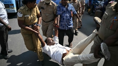 Police personnel detain a protestor in Chennai after trade union members called a nationwide strike or Bharat Bandh on Thursday. (AFP) Police personnel detain a protestor in Chennai after trade union members called a nationwide strike or Bharat Bandh on Thursday. (AFP)