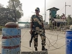 A security officer keeps vigil at the Integrated Check Post (ICP), Fulbari, amid heightened security during Bangladesh's parliamentary elections, near the India-Bangladesh border, in Jalpaiguri district of West Bengal, on Thursday. (PTI)