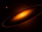 Artistic impression of the ‘eclipse’ due to the newly found brown dwarf with massive rings (foreground) forming an opaque ‘saucer’ through which some light from the star ASASSN-24fw (background) shines. A red dwarf star (left) was also discovered in the neighbourhood during the research. (SOURCED)