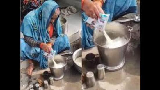 Screen grab from a viral video showing milk being poured into a bucket filled with water. (Sourced)