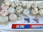 22.295 kg of heroin, two sophisticated Glock pistols, and  <span class='webrupee'>₹</span>2.05 lakh in drug money was seized by Ferozepur police on Saturday. (HT Photo)