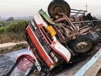A view of a truck overturned in a road accident which killed seven people, on Hoskote-Dabaspet National Highway, in Bengaluru on Friday