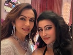 Nita Ambani was captured in a white, silverish saree complemented by diamond jewellery.