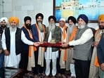 The lawmakers were presented with a model of the holy shrine, siropas and religious literature. (HT) The lawmakers were presented with a model of the holy shrine, siropas and religious literature. (HT)