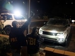 The FBI and Pima County Sheriff’s Department deputies process evidence from a late-model, gray Range Rover as they investigate the disappearance of Nancy Guthrie, the 84-year-old mother of U.S. journalist and television host Savannah Guthrie, at a Culver’s in Tucson, Arizona, U.S. February 13, 2026.  REUTERS/Rebecca Noble