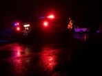 A Pima County Sheriff’s deputy maintains a roadblock in the Catalina Foothills as a suspected raid regarding the disappearance of Nancy Guthrie.