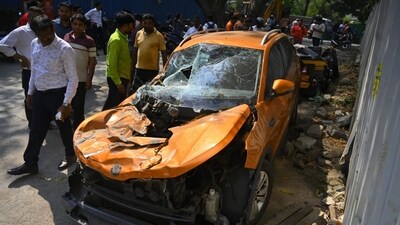 A car stands near the accident site in Mumbai's Mulund after an under construction metro tower collapsed on the road, killing one and injuring three others. The BMC's disaster control wing said the portion of the parapet was approximately 6X4. (Satish Bate/Hindustan Times)