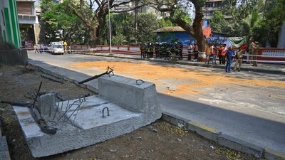 A chunk of concrete lies on the side of the road after a metro tower collapsed in Mumbai's Mulund on Saturday. The MMRDA said an inquiry has been ordered to determine the cause of the collapse, and check construction safety protocols and structural stability measures. (Satish Bate/Hindustan Times)