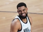 World center Karl-Anthony Towns smiles during the NBA All-Star basketball game against the USA Stars Sunday, Feb. 15.