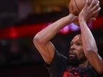 Kevin Durant faces backlash after being exposed for using a burner account to criticize teammates.Credit: Thomas Shea-Imagn Images
