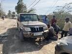 On Friday, a PWD vehicle got damaged on the same stretch due to the poor condition of the road, locals claimed. (HT Photo)
