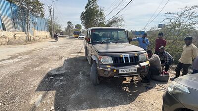 On Friday, a PWD vehicle got damaged on the same stretch due to the poor condition of the road, locals claimed. (HT Photo)