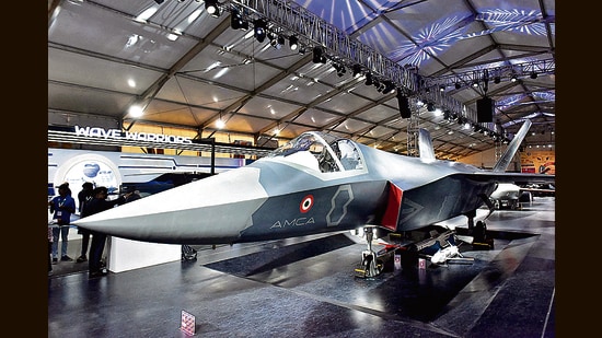 Visitors stand next to a prototype of the Advanced Medium Combat Aircraft (AMCA), India's most advanced stealth fighter jet, at an air show (File photo)